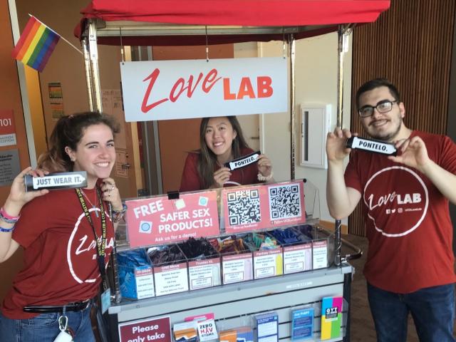photo of three HEP volunteers in front of the Love Lab